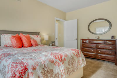 Cozy private resident bedroom with floral bedding