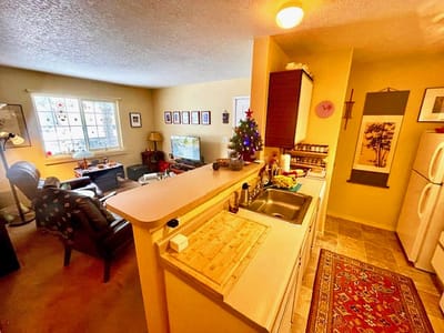 Cozy interior of a senior living unit with a festive touch