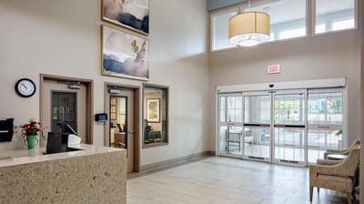 Bright lobby area with seating and front desk