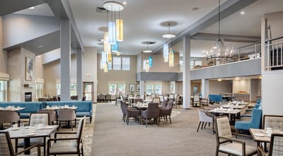 Modern dining area with tables and decorative lighting