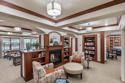 Cozy common area with comfortable seating and bookshelves
