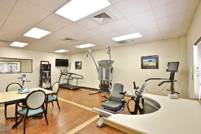 Interior view of a therapeutic exercise room with equipment