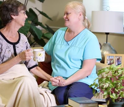 Staff and resident sharing a moment indoors