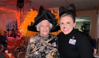 Resident and staff member celebrating Halloween together