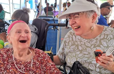 Two happy residents enjoying a social event.