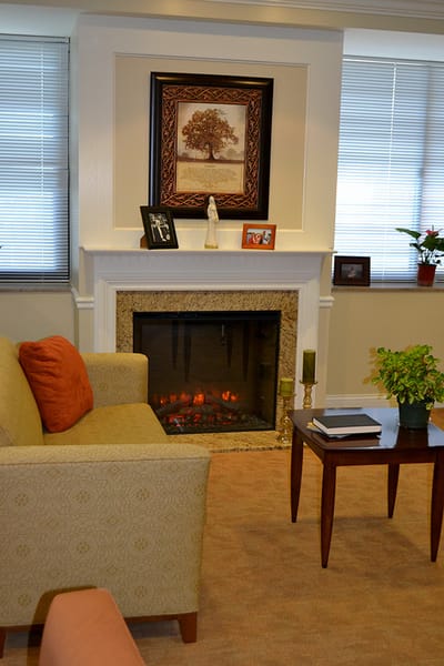 Cozy interior space with a fireplace and seating.