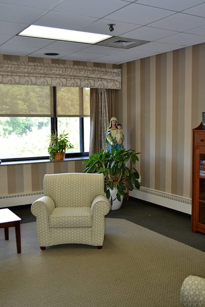 Cozy common area with seating and plants.