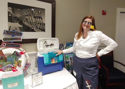 Staff member interacting with a display in the facility.