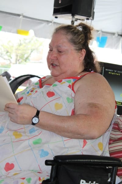 Resident reading at a community event.