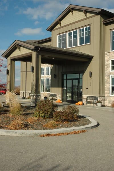Exterior view of the facility with entrance and landscaping