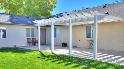Covered outdoor patio area with seating
