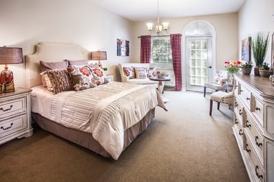 Well-furnished resident room with natural light