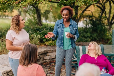 Residents engaging in a group discussion outdoors