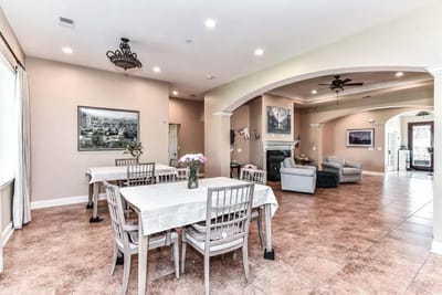 Bright common area with seating and dining tables