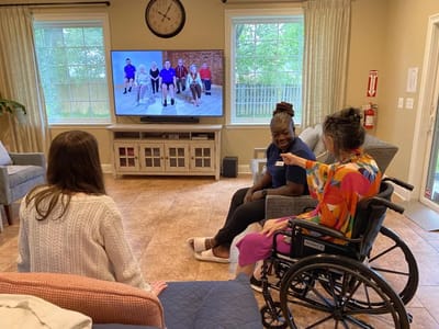 Residents and staff interacting in a common area