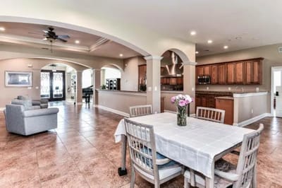 Bright interior common area with dining table and seating