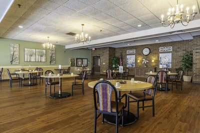 Interior view of a dining room with tables and chairs
