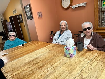 Three residents enjoying time together in a common area