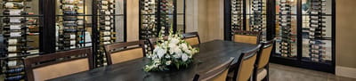 Elegant dining area with wine storage and flowers