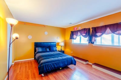 A cozy resident room with warm colored walls