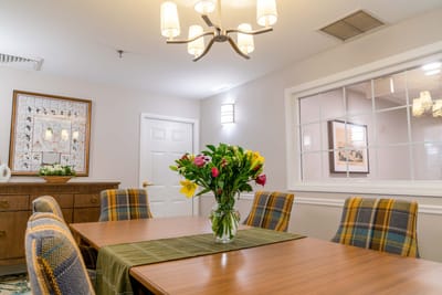 Bright dining room with floral centerpiece