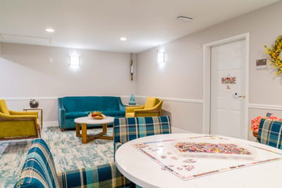 Bright common area with colorful seating and decor