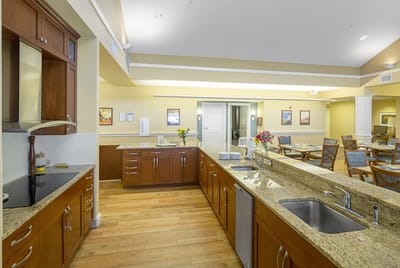 Bright interior kitchen with countertops and seating