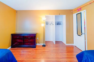Bright, spacious resident room with wooden flooring