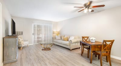 Bright interior of a living space with a sofa and dining table