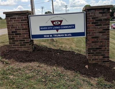 Sign for River City Living Community at the entrance