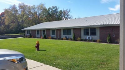 Exterior view of Jefferson City Manor building and lawn