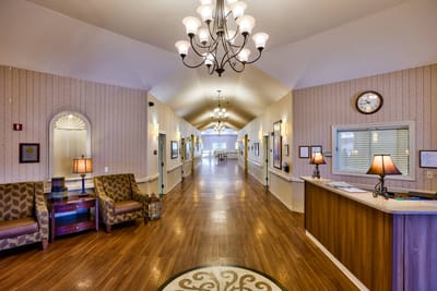 Interior view of a brightly lit hallway with seating