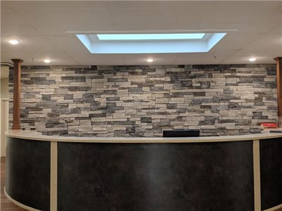 Reception area with stone wall design