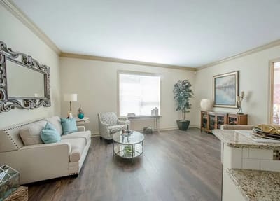 Bright, spacious lounge area with seating and decor