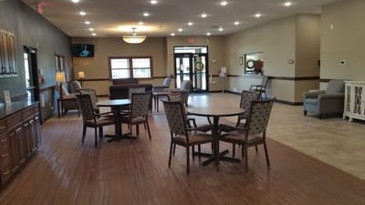 Bright common area with seating and tables