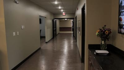 Interior hallway with decorative flowers on a counter