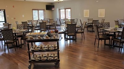 Dining room with tables and food service cart