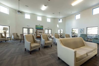 Bright common area with seating and windows