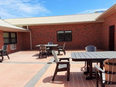 Outdoor patio area with tables and chairs