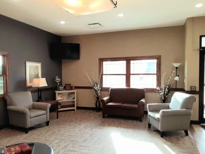 Cozy common area with sofas and decorative plants