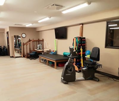 Interior view of a rehabilitation room with exercise equipment