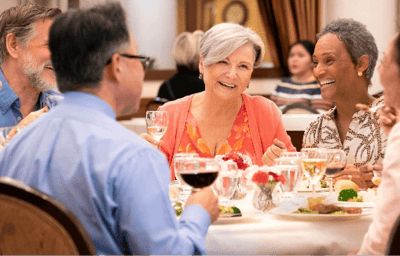 Residents enjoying a meal together in the dining room