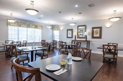 Dining room area with tables set for residents