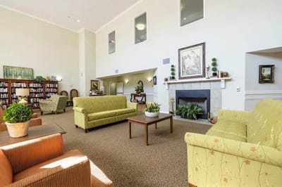 Cozy common area with seating and bookshelves