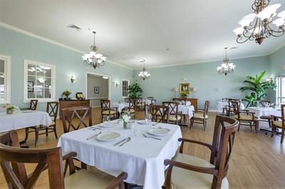 Well-decorated dining room with elegant tables and chairs