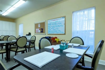 Art activity space with tables and supplies