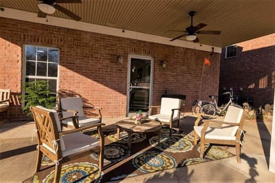 Outdoor seating area with chairs and a small table