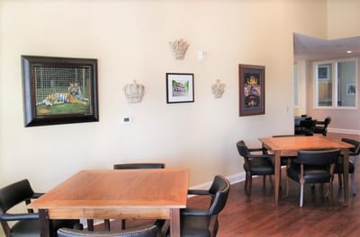 Interior view of a common area with wooden tables.