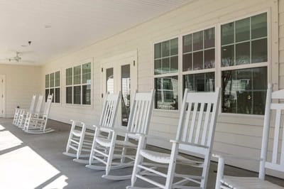 Outdoor rocking chairs on a covered porch