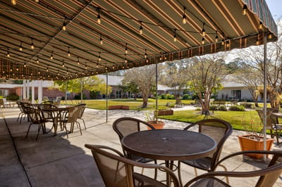 Outdoor patio area with seating and garden views